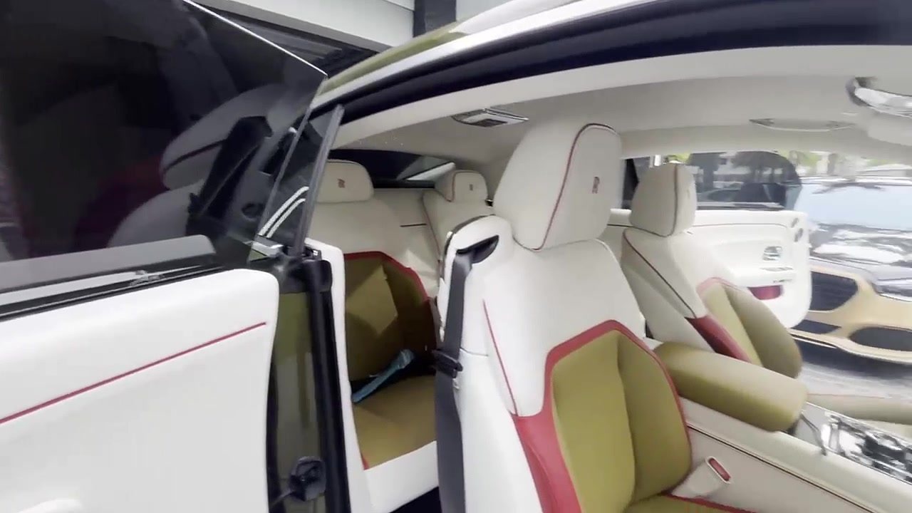 Sunlit luxury car cabin seen through tinted side glass